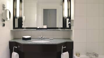 Separate tub and shower, designer toiletries, hair dryer, bathrobes