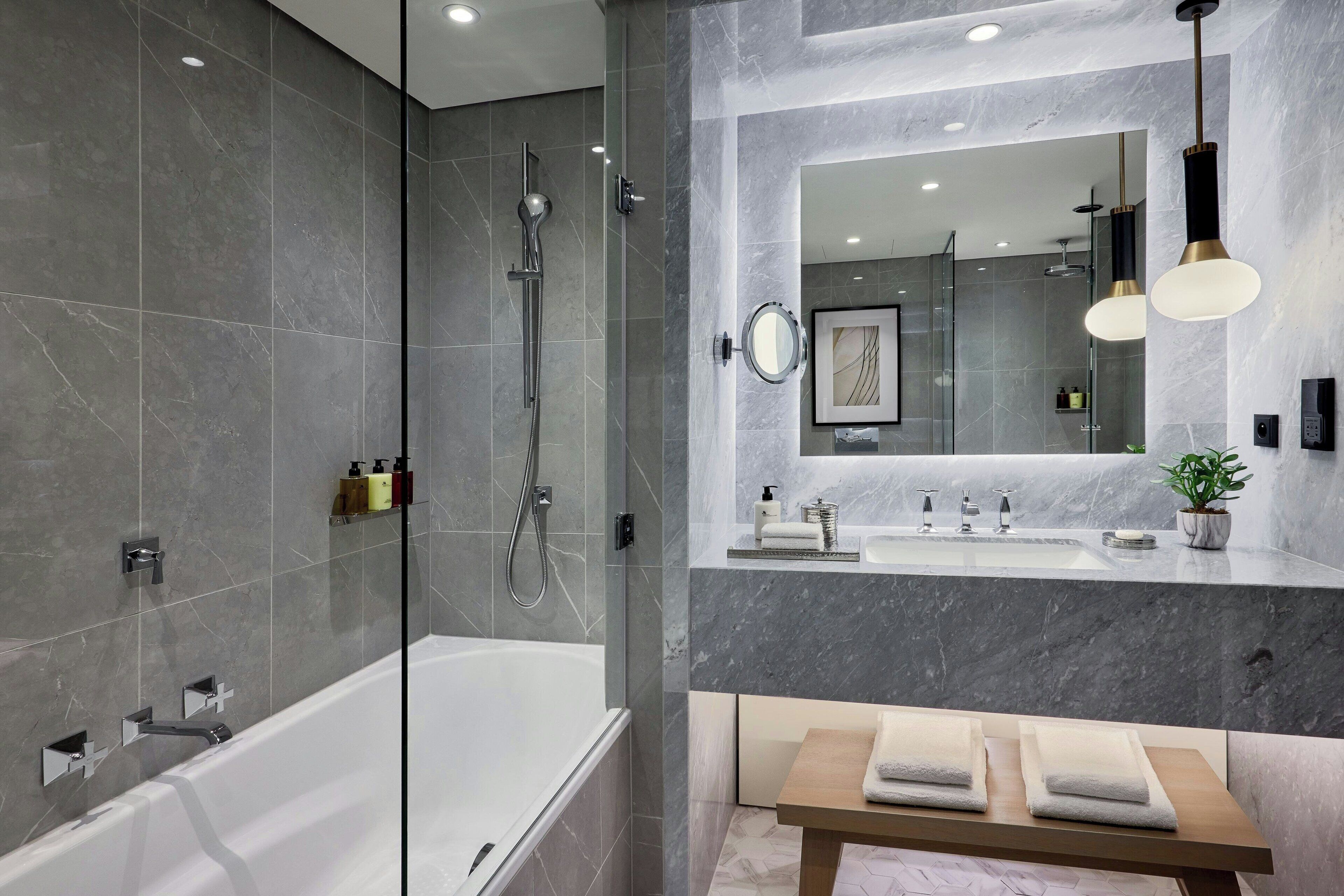 separate bathtub and shower, designer toiletries, hair dryer, bathrobes