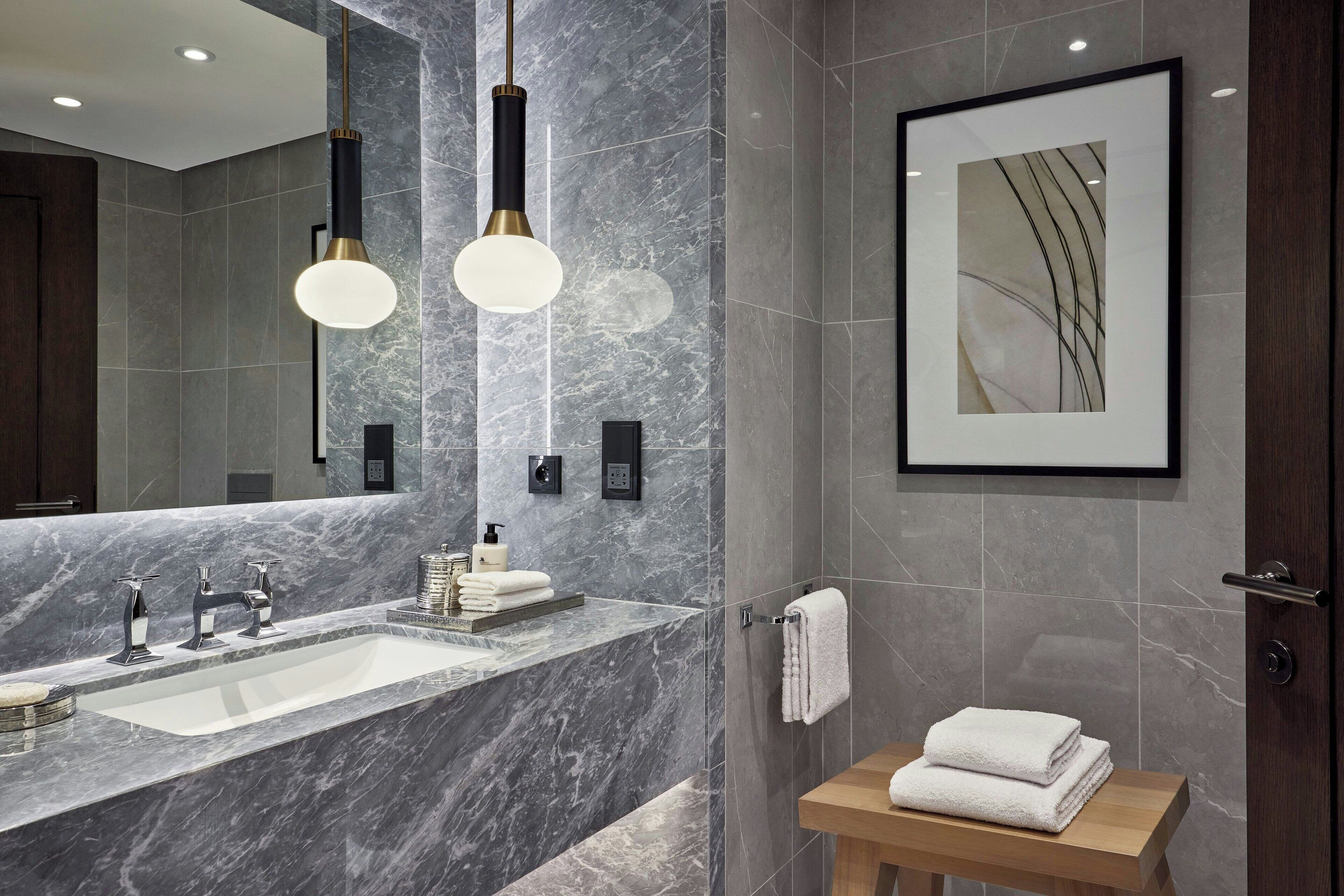 separate bathtub and shower, designer toiletries, hair dryer, bathrobes