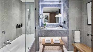 Separate tub and shower, designer toiletries, hair dryer, bathrobes