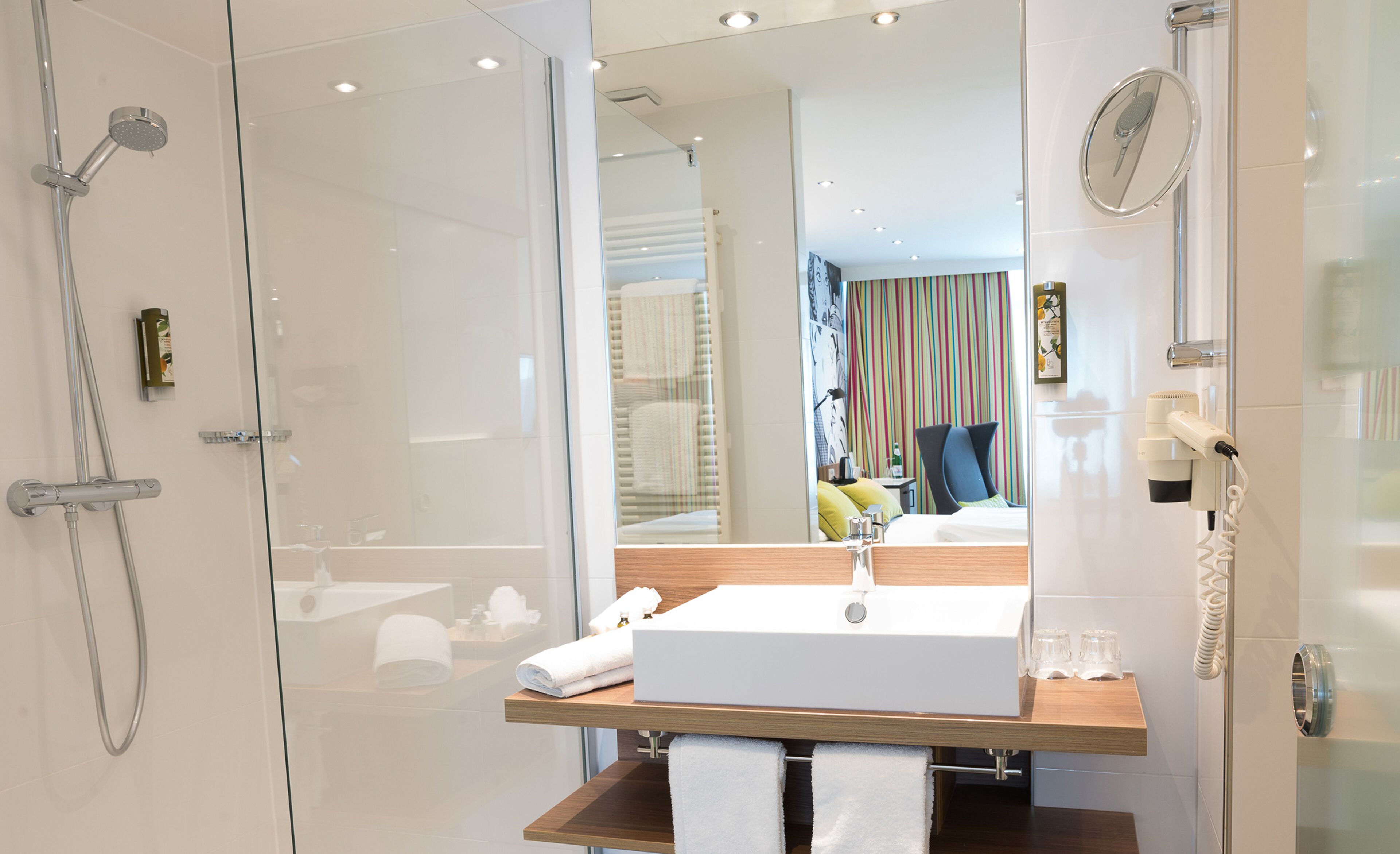 superior double room | bathroom | shower, hair dryer, soap, shampoo