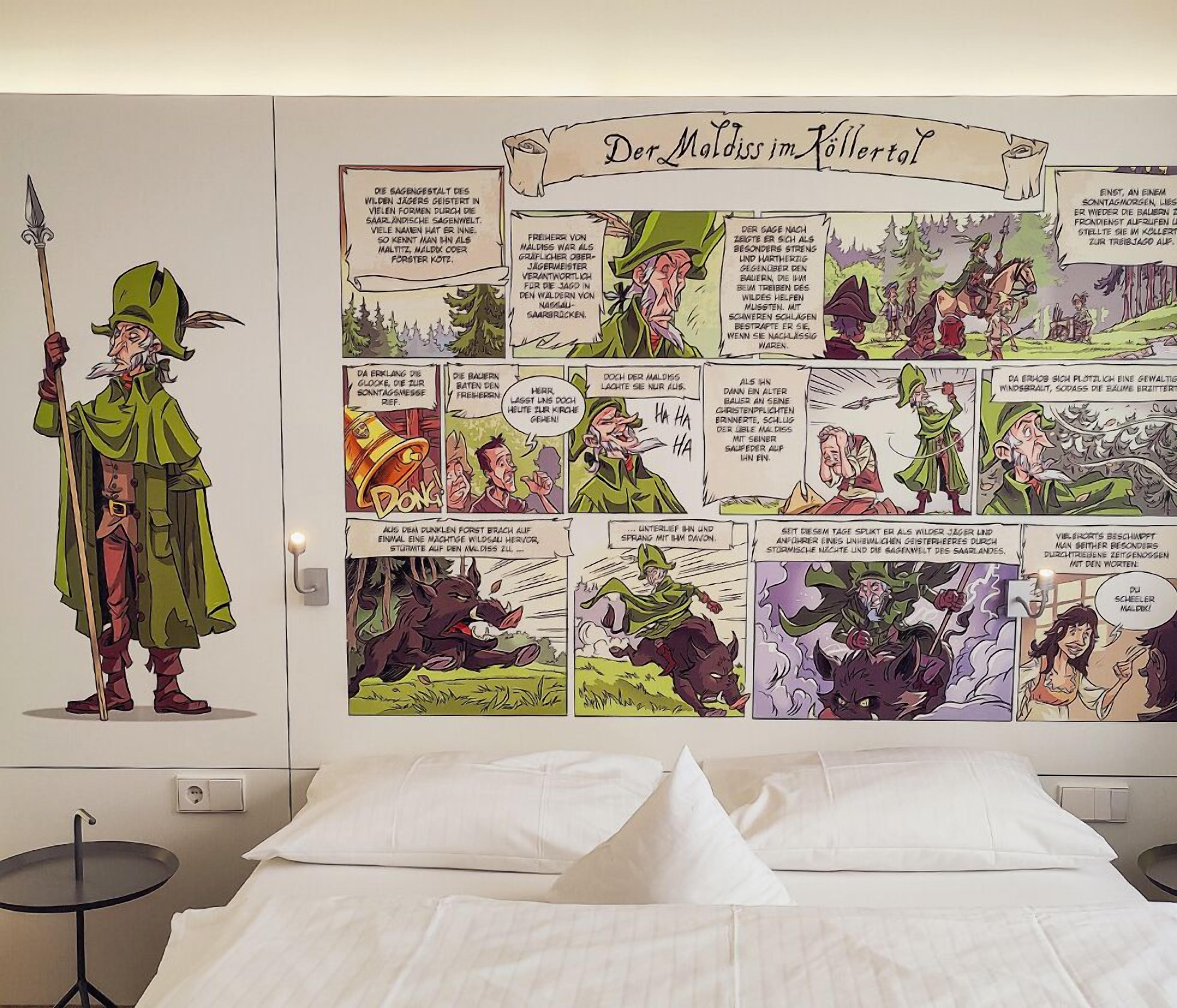 A bedroom with a large mural depicting a comic strip titled "Der Moldiss im Köllertal" on the wall.