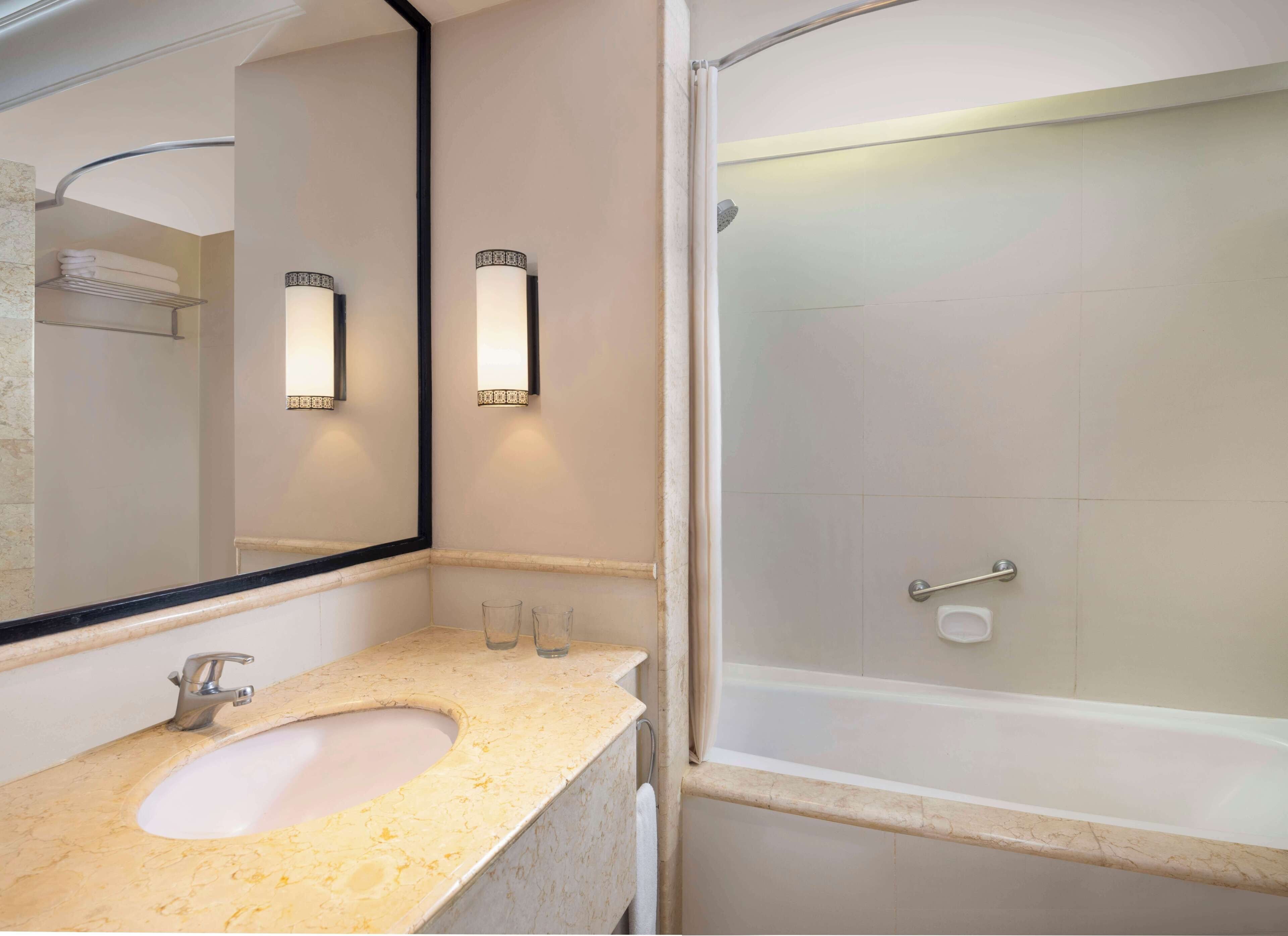 rainfall showerhead, hair dryer, bathrobes, slippers