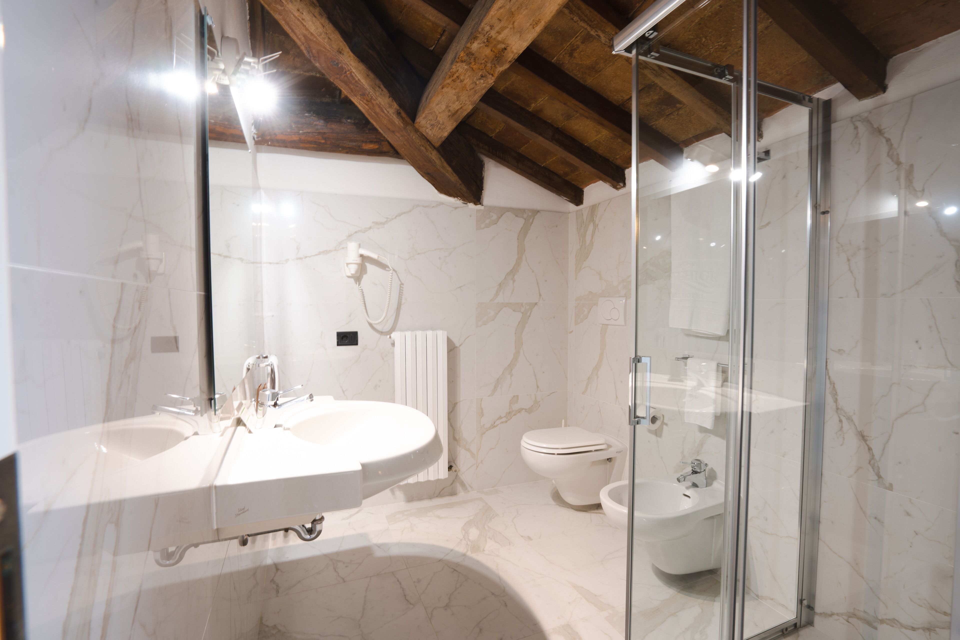 free toiletries, hair dryer, slippers, bidet