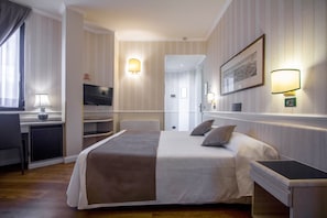 Premium bedding, down comforters, minibar, in-room safe