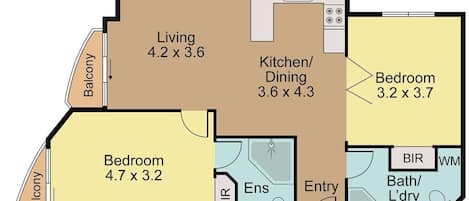 A floor plan with a living room, kitchen/dining, two bedrooms, a balcony, a bathroom, and an entryway.