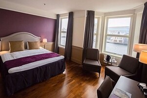 Pillowtop beds, desk, blackout drapes, iron/ironing board