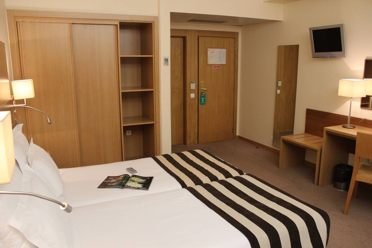 Ropa de cama de alta calidad y minibar