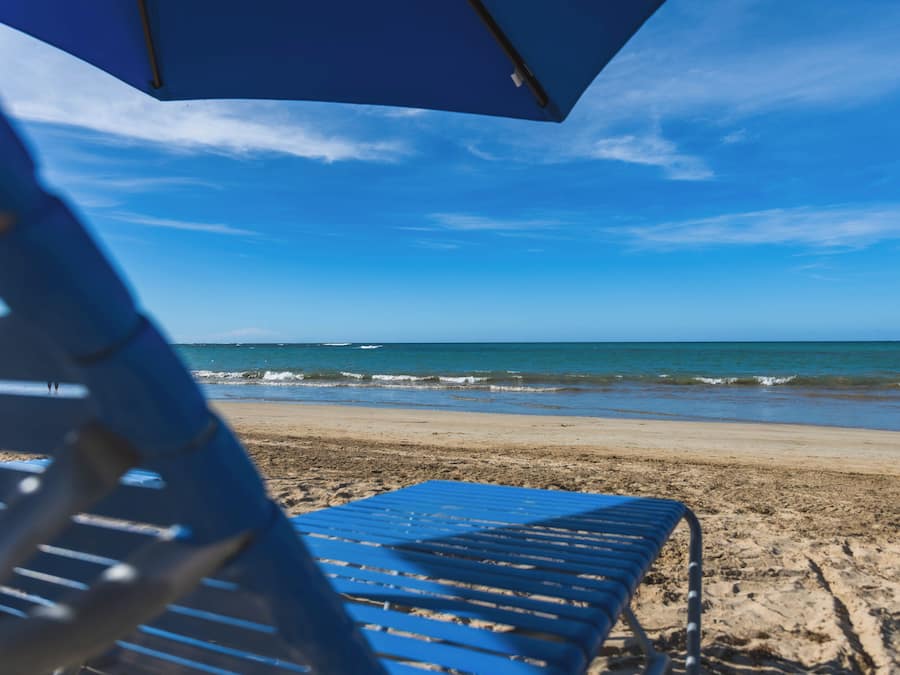 Beach nearby, white sand, beach umbrellas, beach towels