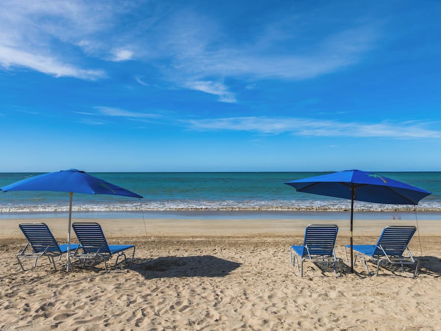 Beach nearby, white sand, beach umbrellas, beach towels