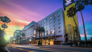 A hotel with a modern design, featuring multiple floors and a prominent sign. - Jeju Sun Hotel & Casino (Jeju City)