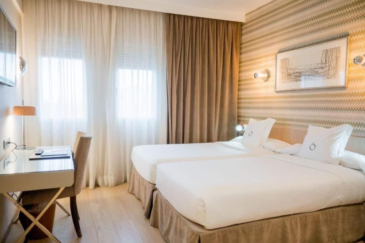 Roba de llit d'alta qualitat, minibar i caixa forta a l'habitació