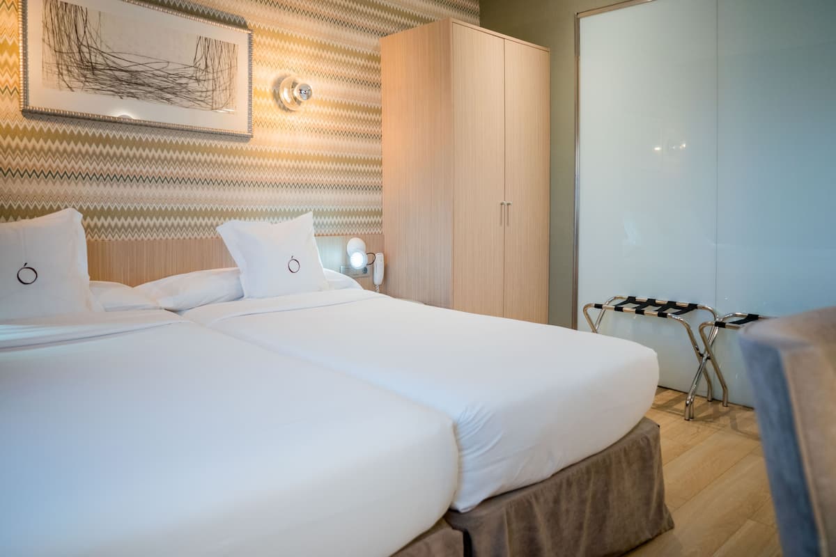 Roba de llit d'alta qualitat, minibar i caixa forta a l'habitació