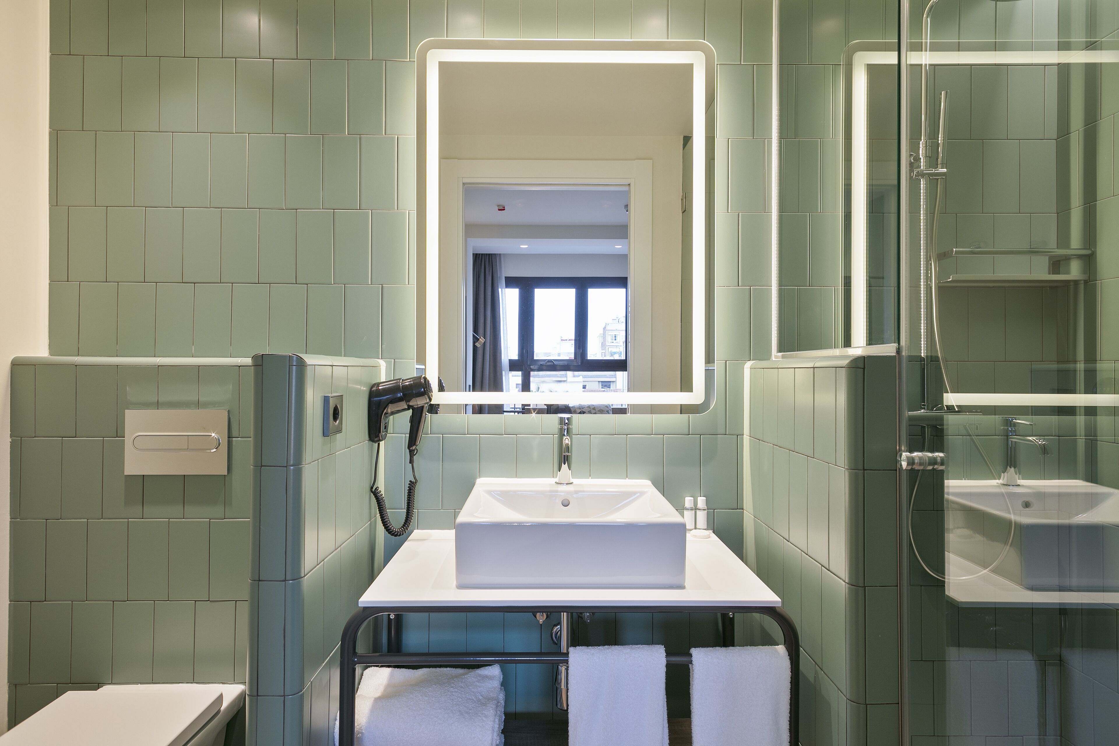 superior double room | bathroom | rainfall showerhead, hair dryer, towels, soap