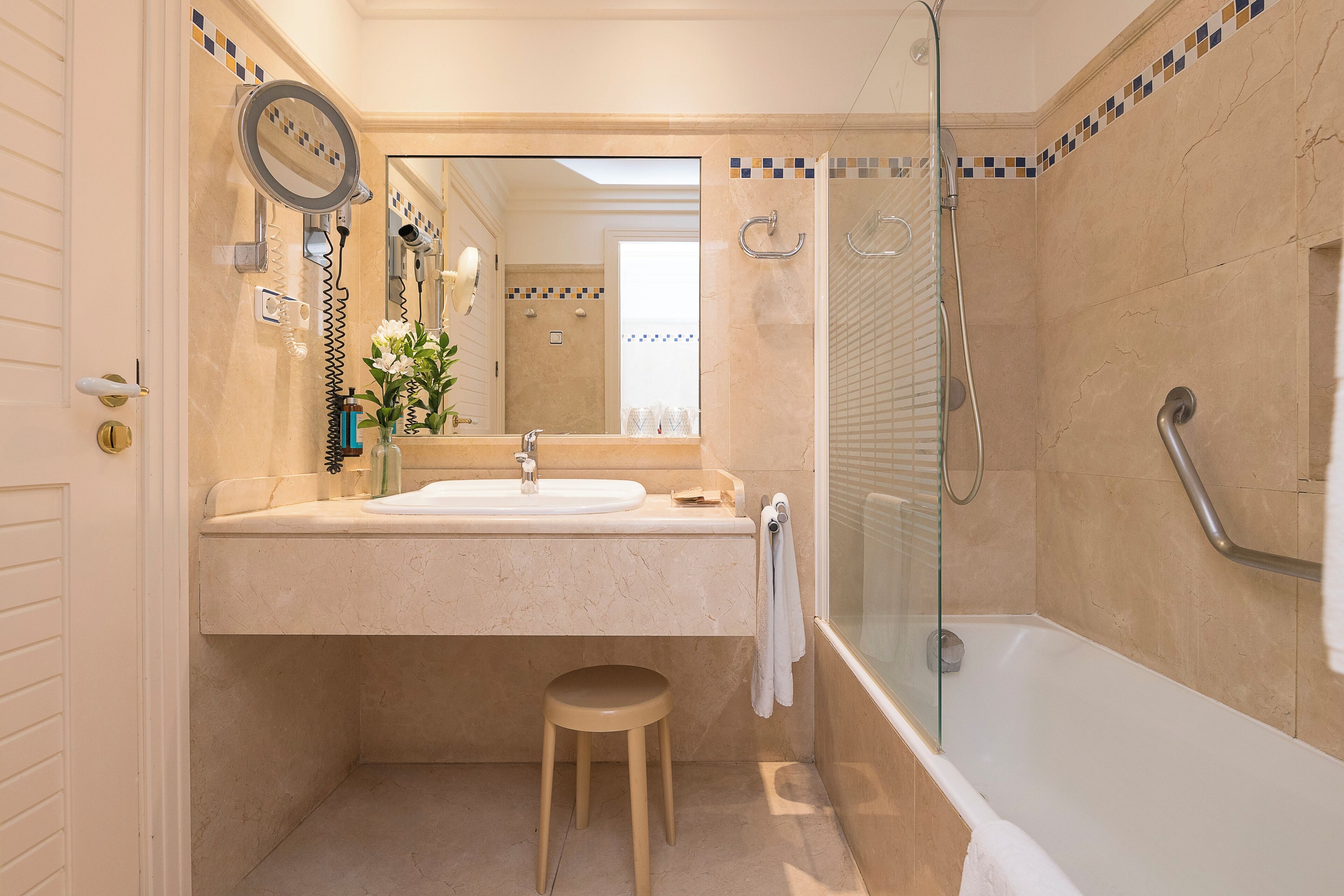 bathtub, hair dryer, towels