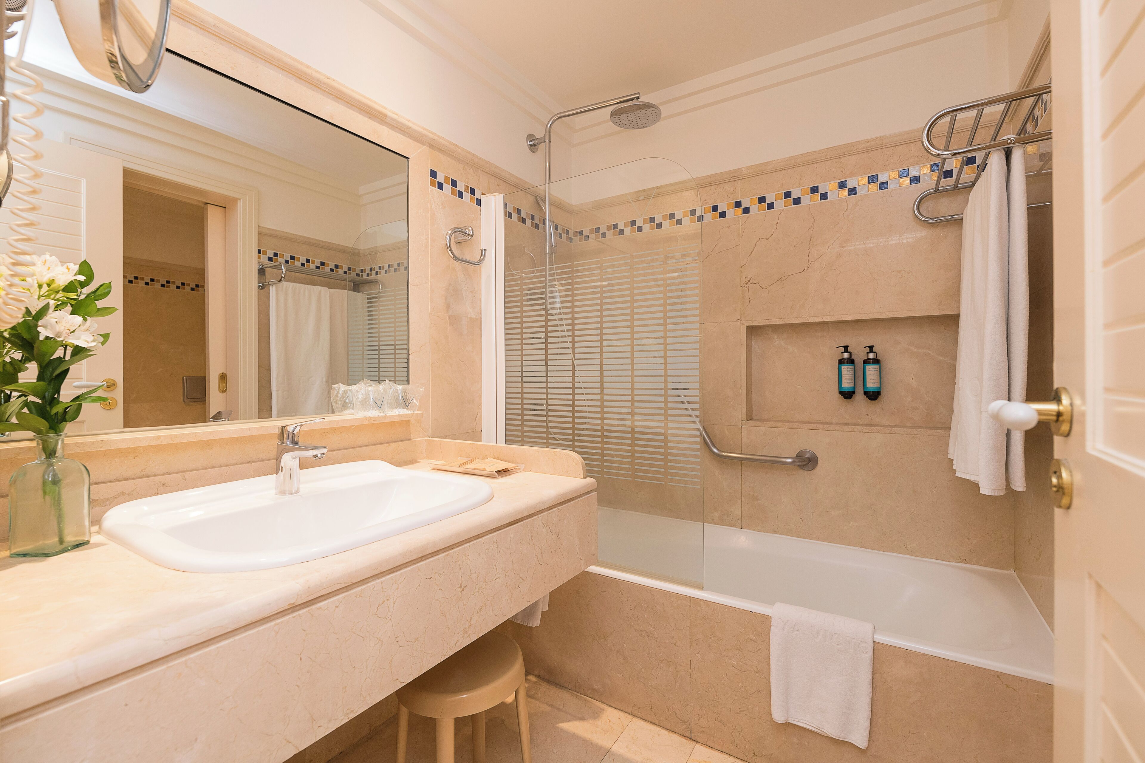 bathtub, hair dryer, towels