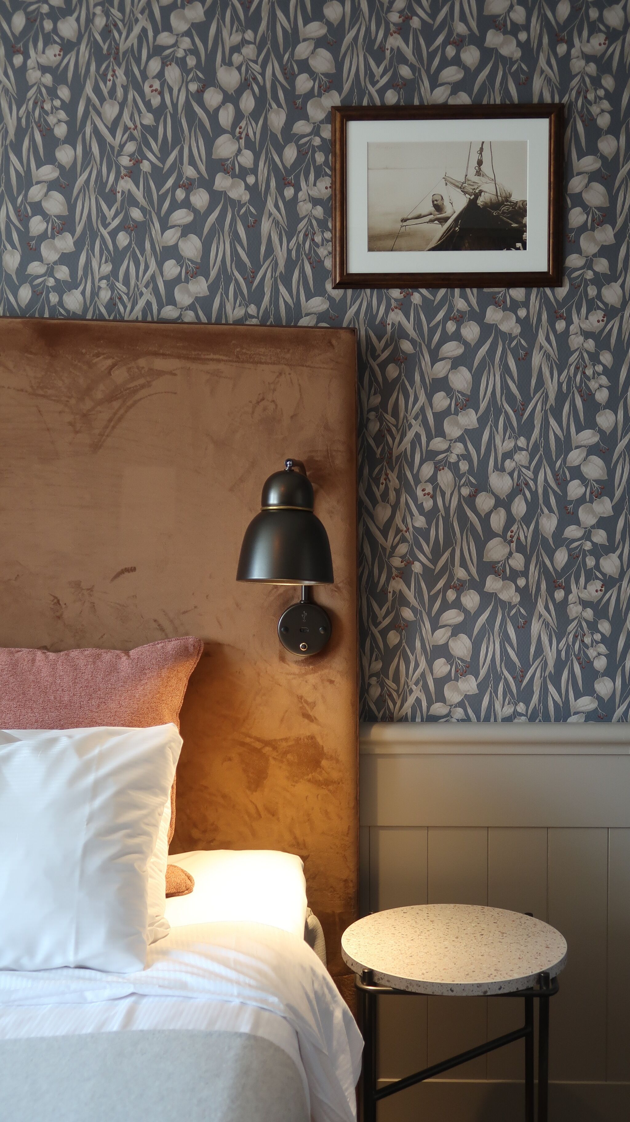 desk, laptop workspace, iron/ironing board, bed sheets