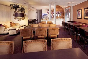 Relax in style with a plush sofa, dining area, and separate seating space.