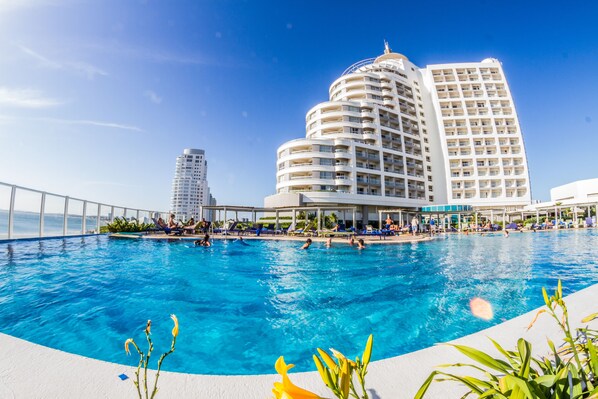 Indoor pool, seasonal outdoor pool, pool umbrellas, pool loungers