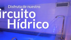 A swimming pool with a blue interior, metal handrails, and a towel on the edge. - 101 Park House (Bogotá)