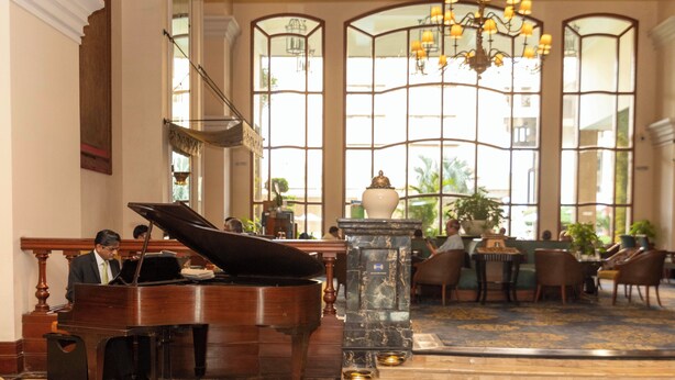A grand lobby with a grand piano, marble flooring, and large arched windows with a chandelier. - Eros Hotel New Delhi by IHG (New Delhi)