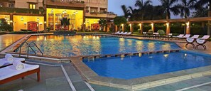 Outdoor pool, open 6:00 AM to 8:00 PM, pool loungers