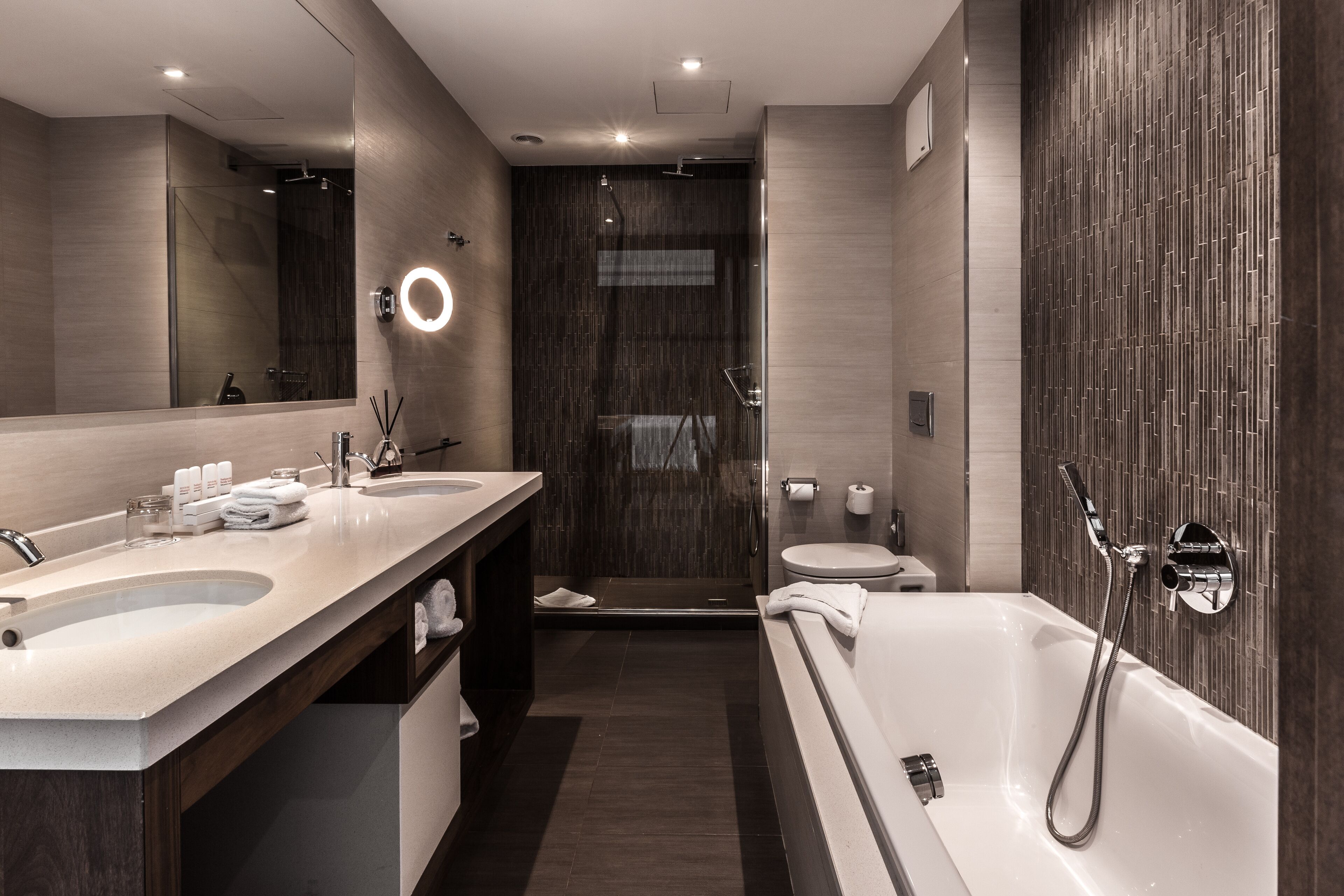 combined shower/bathtub, deep-soaking bathtub, designer toiletries