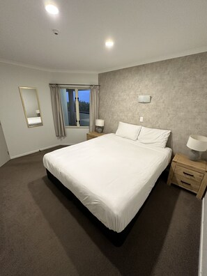 1 bedroom, premium bedding, laptop workspace, iron/ironing board