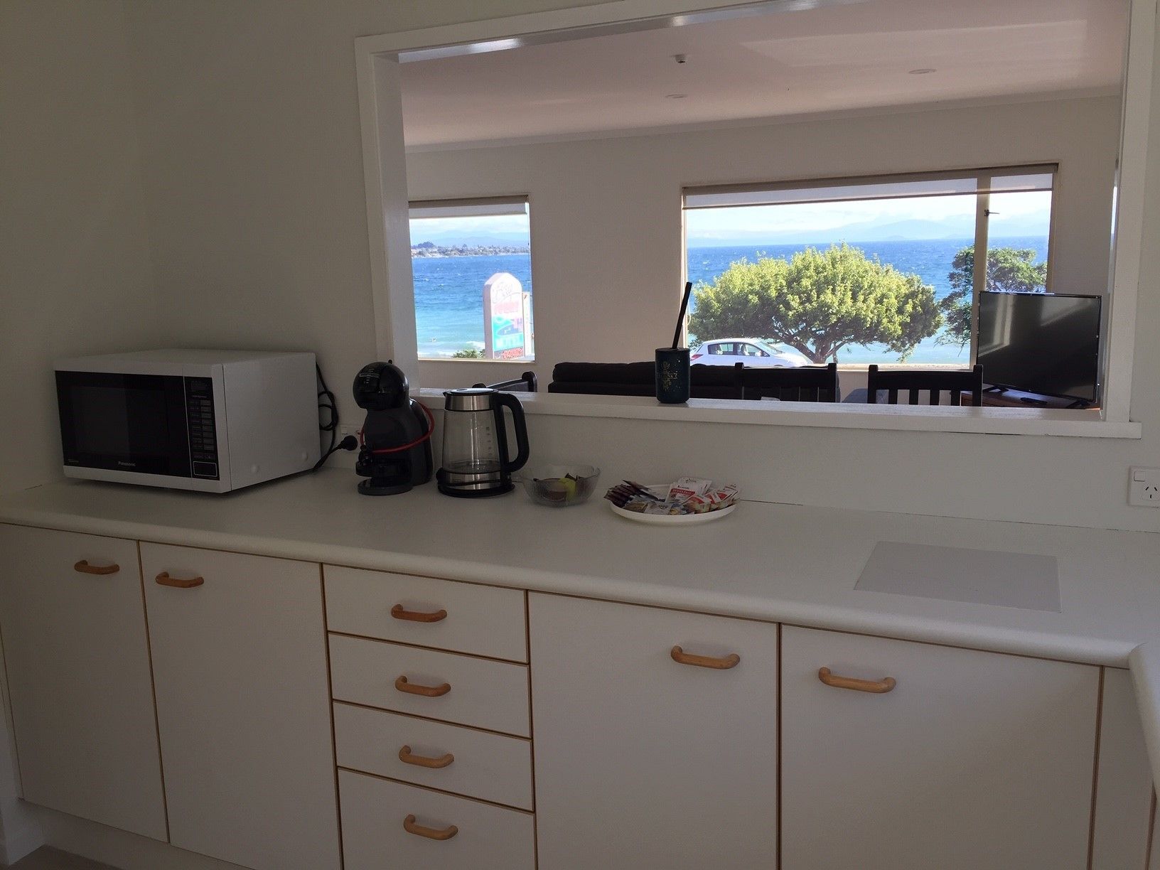 Mini-fridge, microwave, electric kettle, cookware/dishes/utensils