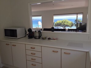 Mini-fridge, microwave, electric kettle, cookware/dishes/utensils