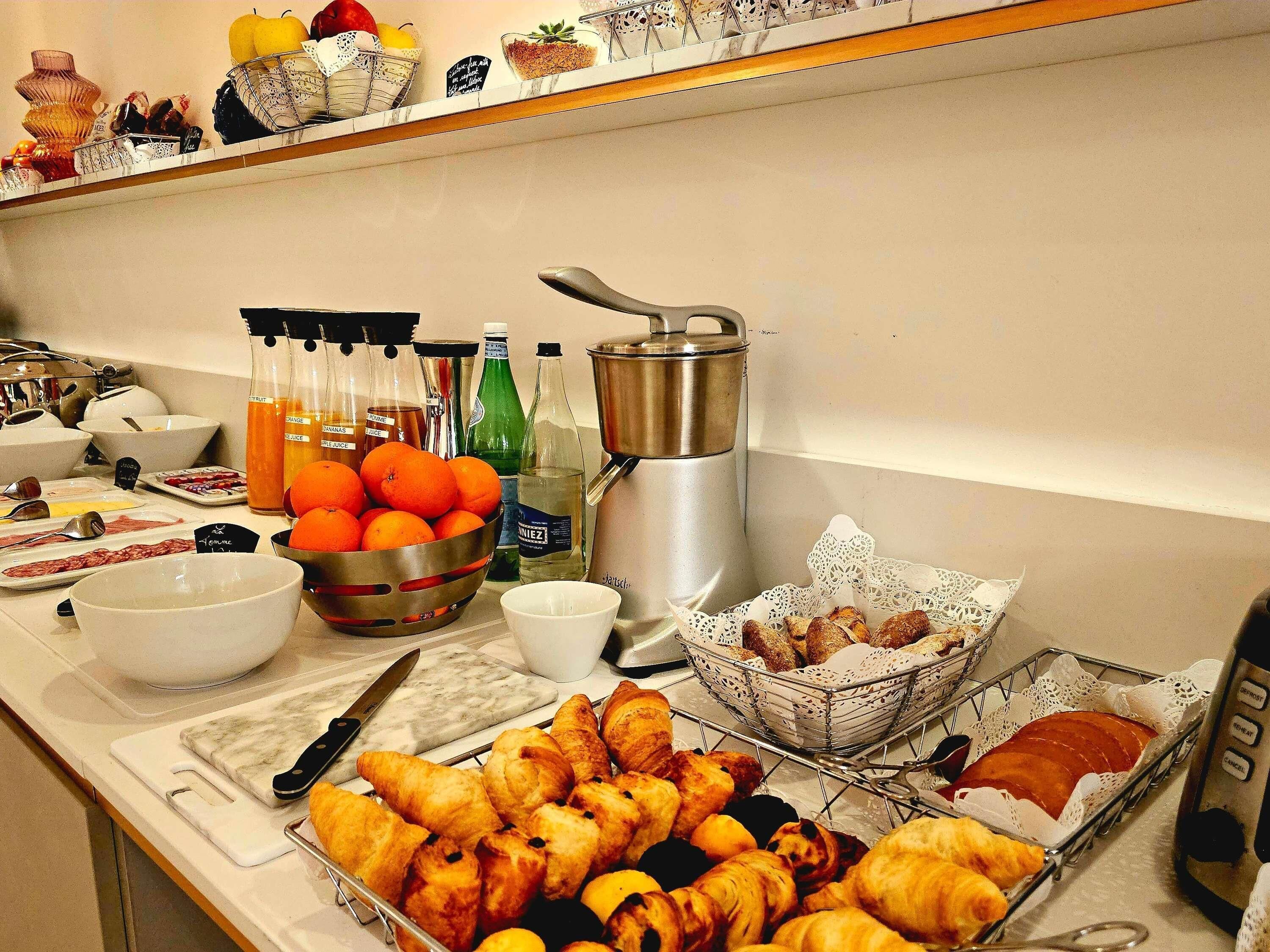 A breakfast buffet with various food items and beverages.
