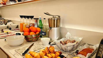 A breakfast buffet with various food items and beverages.