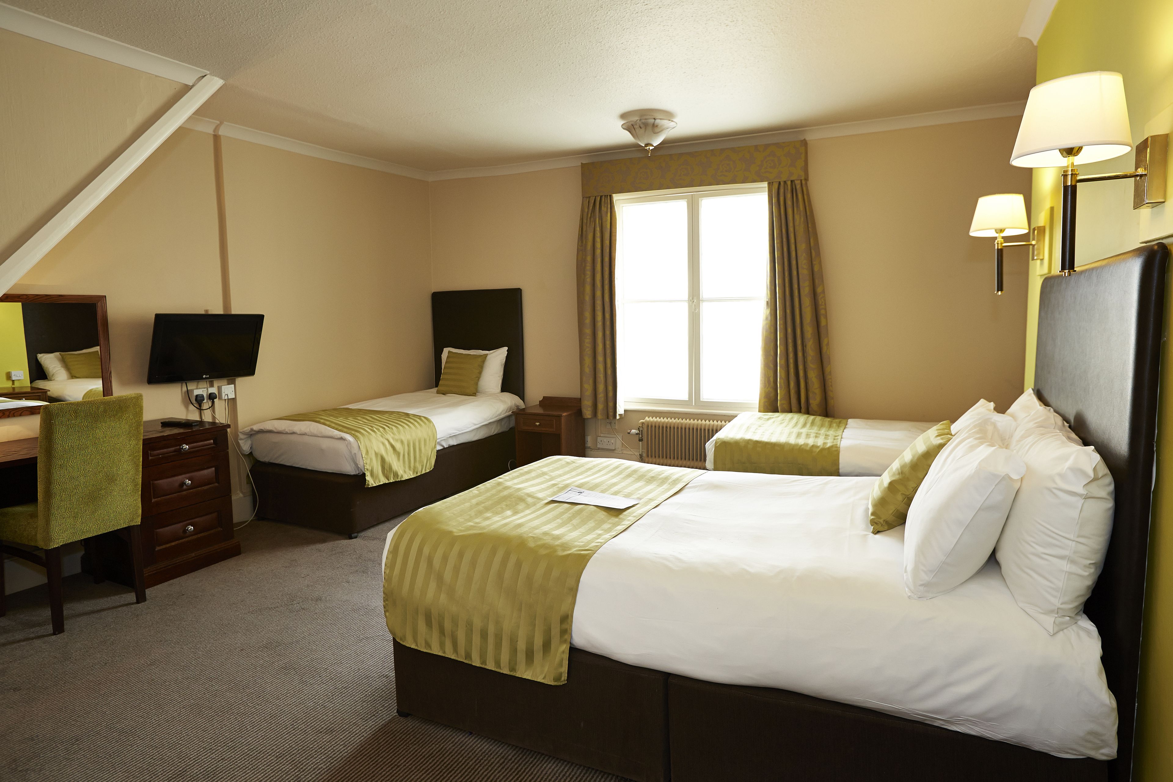 family room for 2 adults and 2 children | in-room safe, desk, iron/ironing board, free wifi