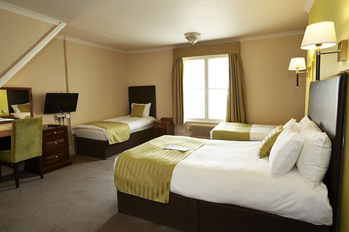 family room for 2 adults and 2 children | in-room safe, desk, iron/ironing board, free wifi