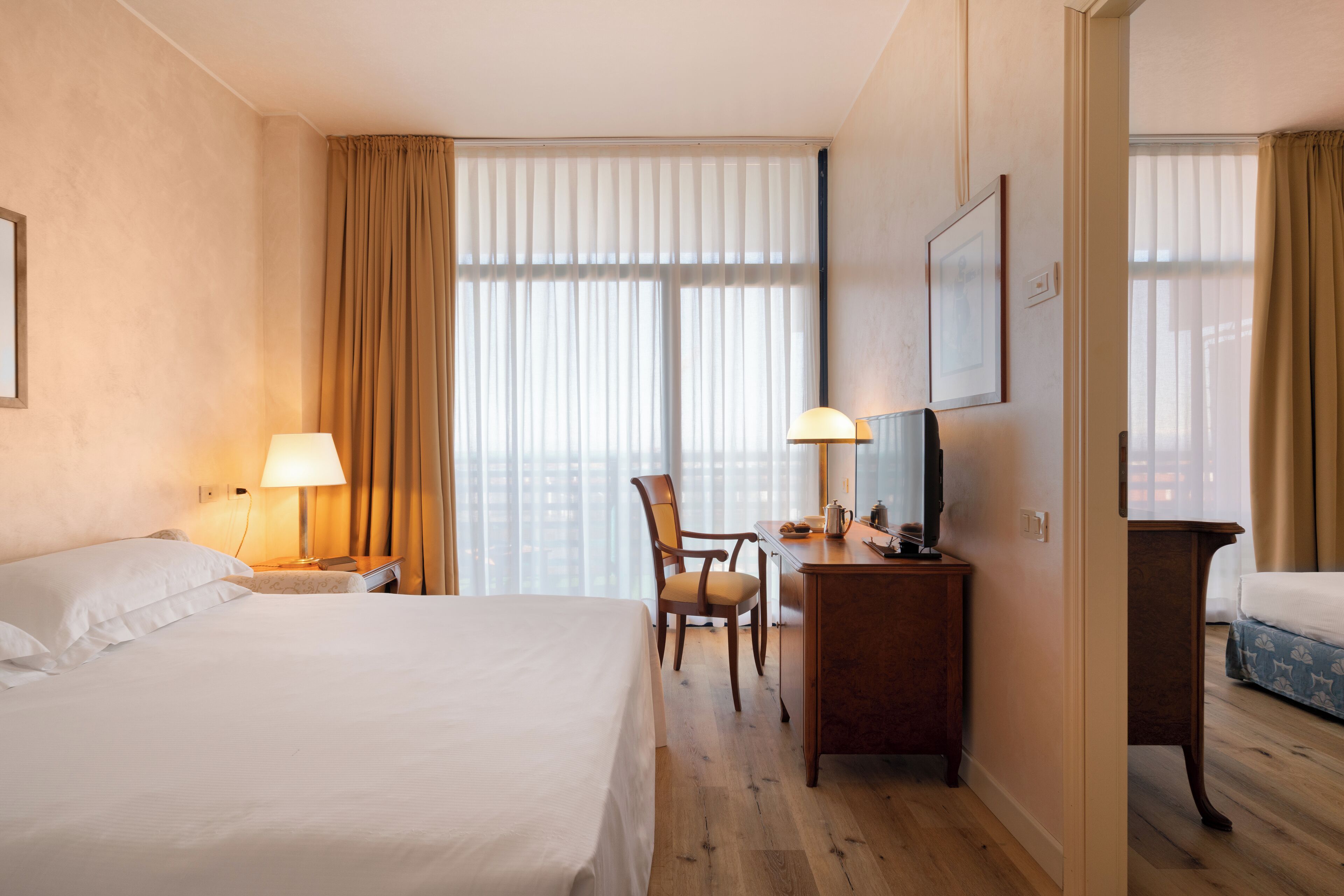 junior suite, balcony | living area | tv