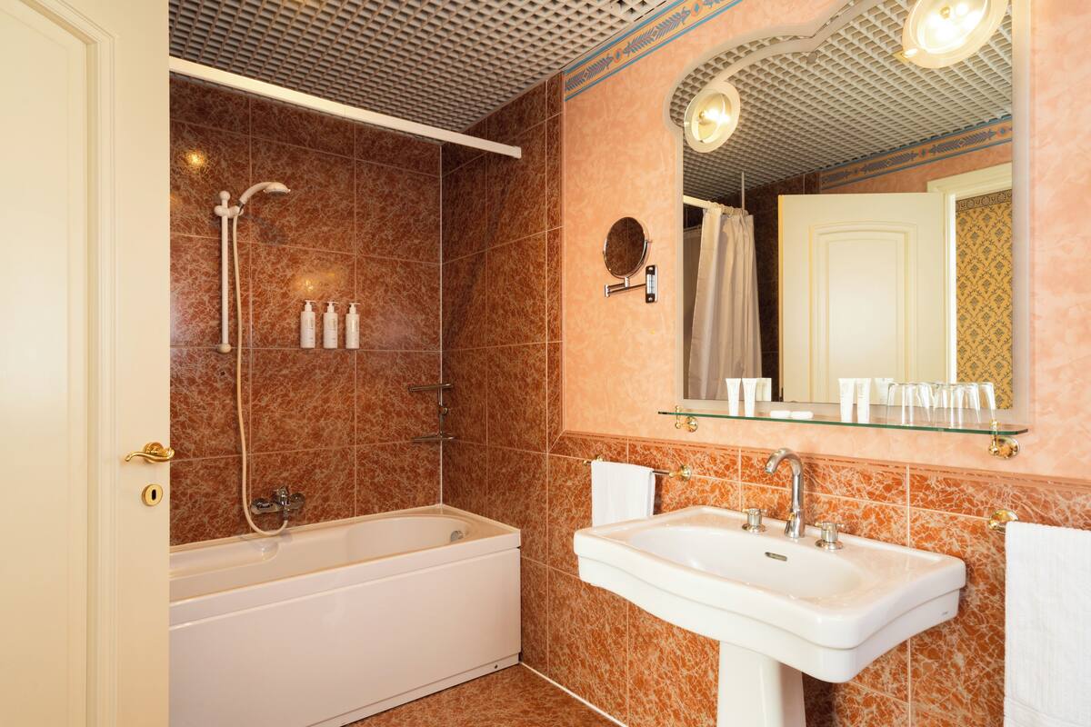 suite | bathroom | hair dryer, bathrobes, bidet, towels
