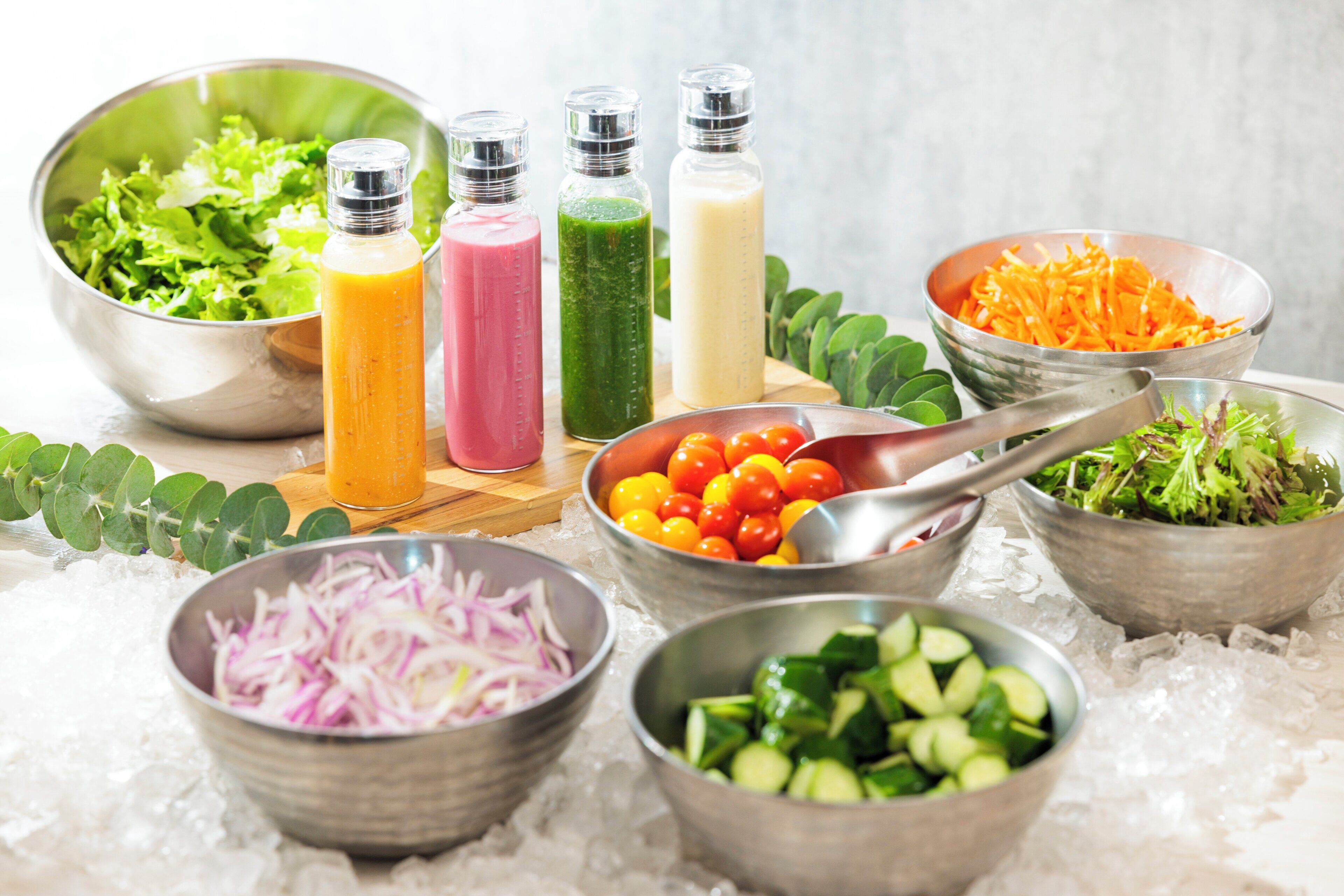 A variety of food items and ingredients on a table with ice.