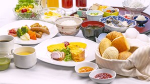 A variety of dishes and beverages on a table, including plates of food, bowls, and cups. - Numazu Riverside Hotel (Numazu)