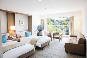 Relax in this stylish room with two single beds, a flat-screen TV, and a balcony offering a view of the surrounding landscape.