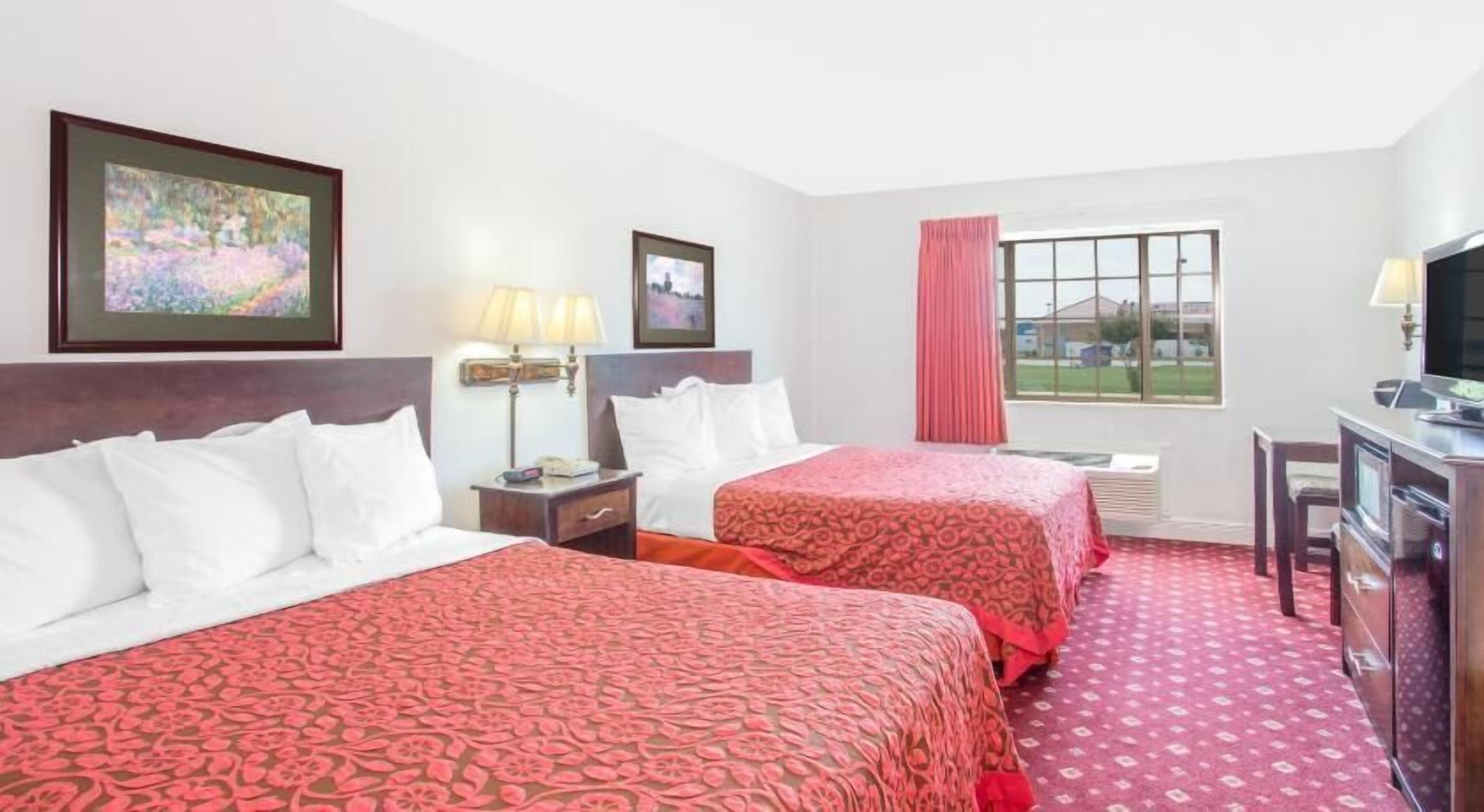 Premium bedding, pillow-top beds, desk, laptop workspace