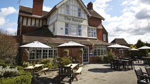 The Raven Hotel with outdoor seating and a garden. - The Raven Hotel by Greene King Inns (Hook)