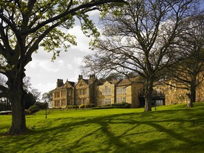 A large, historic stone building with multiple windows and a well-maintained lawn. - Hollins Hall Hotel, Spa & Golf (Shipley)