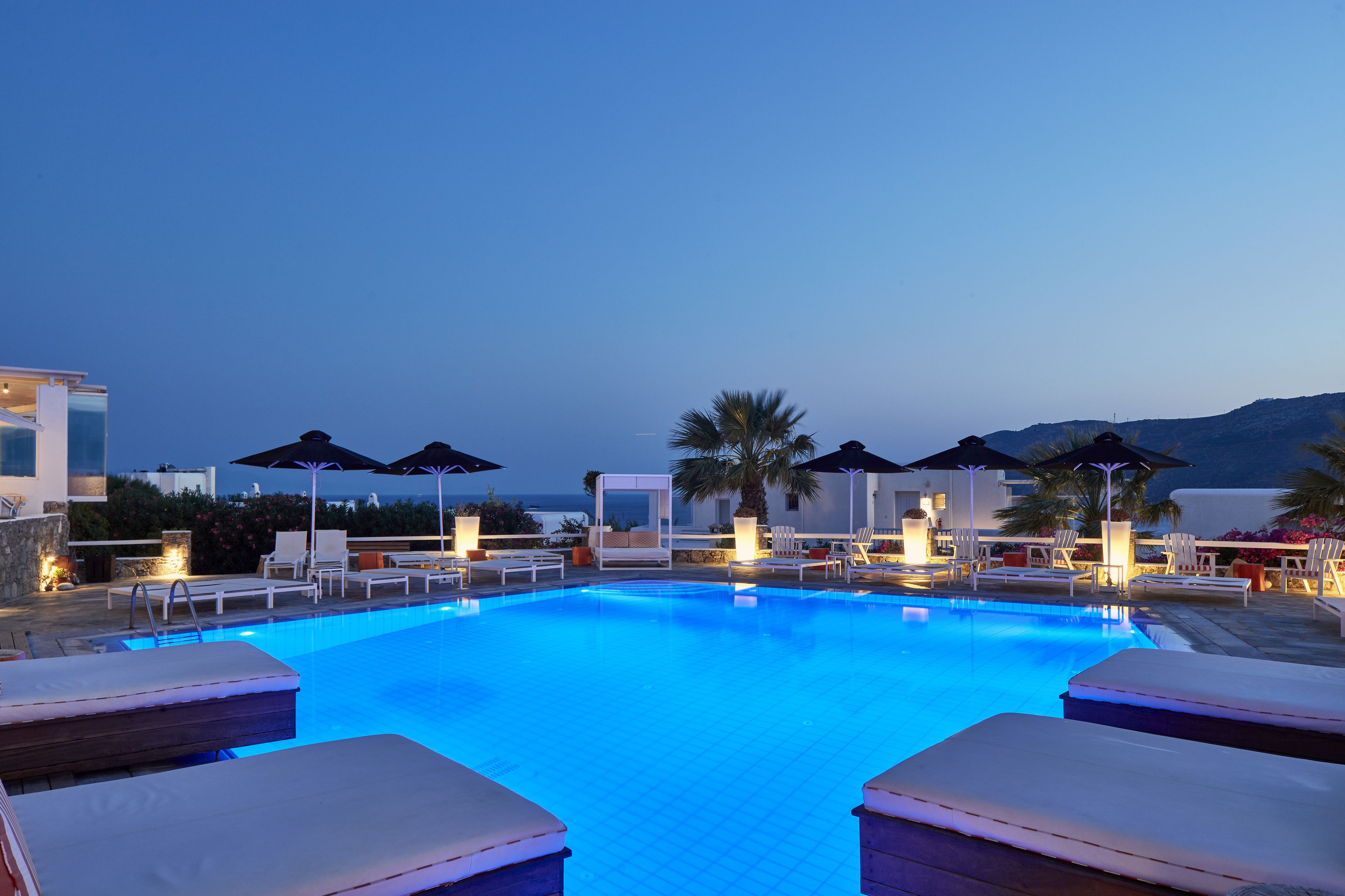 seasonal outdoor pool, pool umbrellas, pool loungers