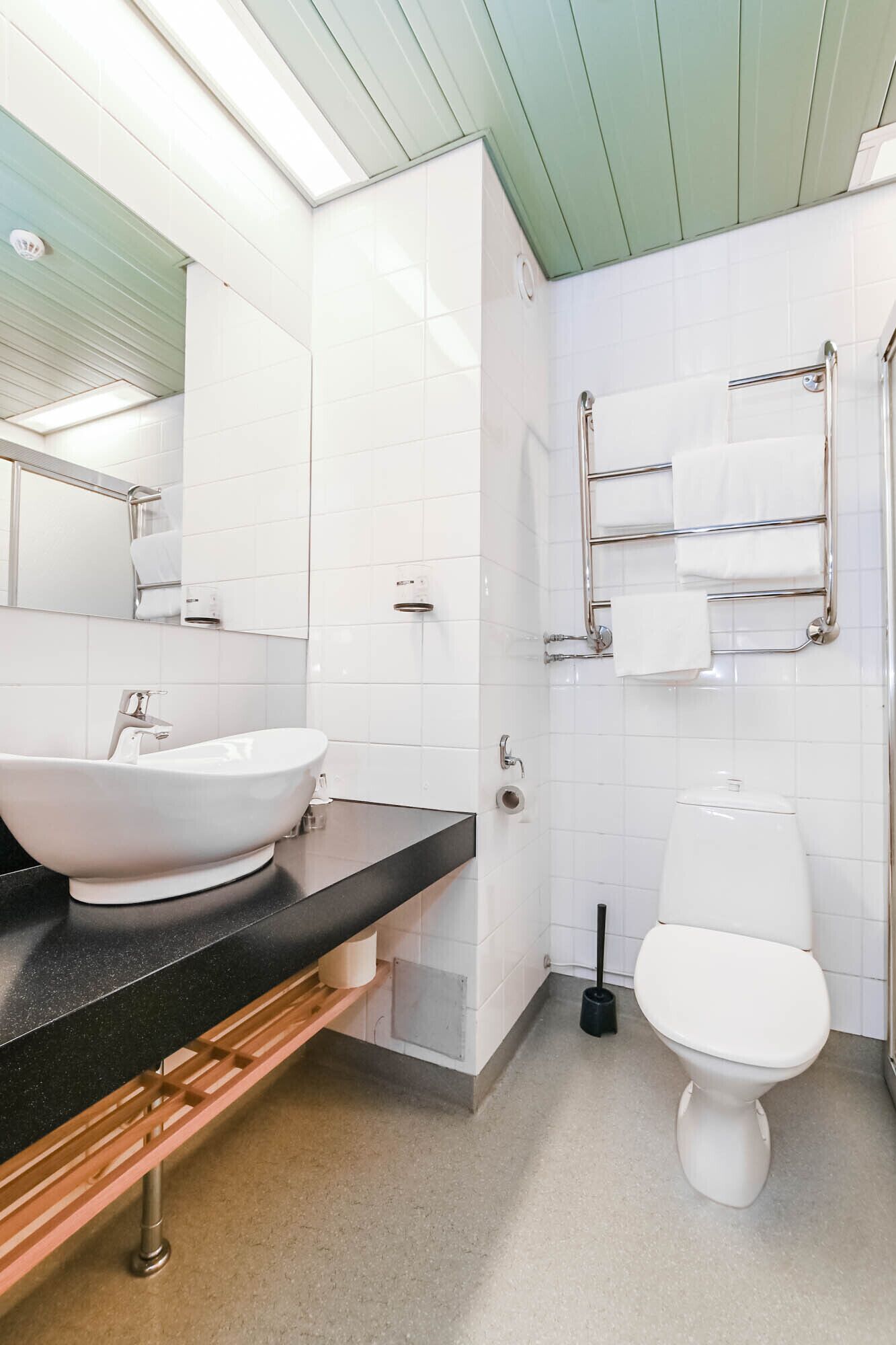 shower, hair dryer, slippers, towels