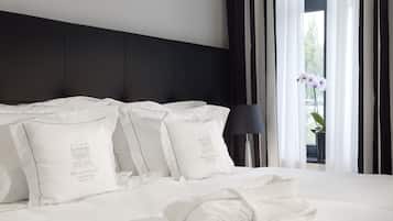 Premium bedding, down comforters, pillowtop beds, minibar