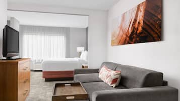 Premium bedding, desk, laptop workspace, blackout curtains
