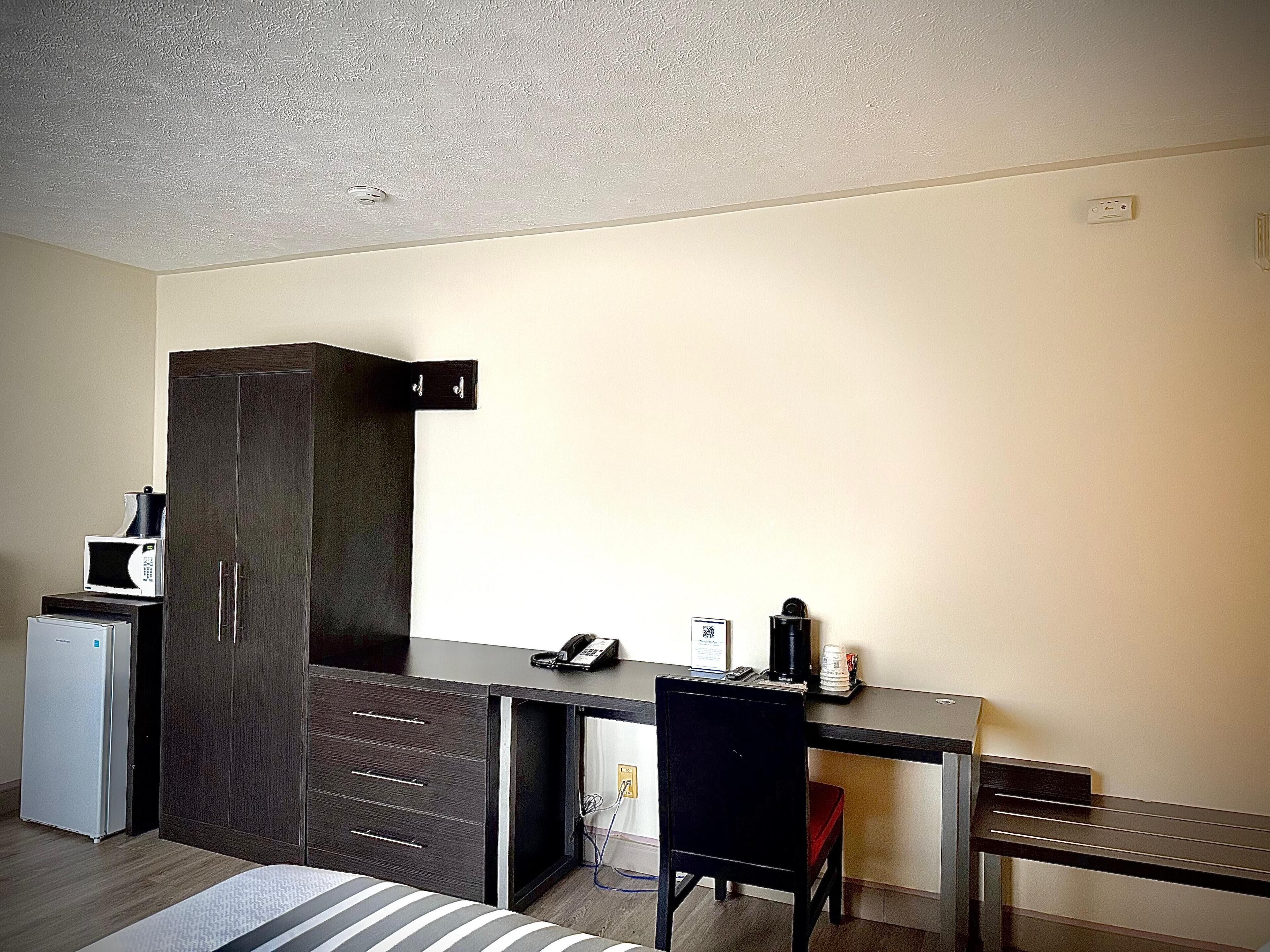 standard room, 2 queen beds, non smoking, refrigerator | in-room safe, desk, laptop workspace, iron/ironing board