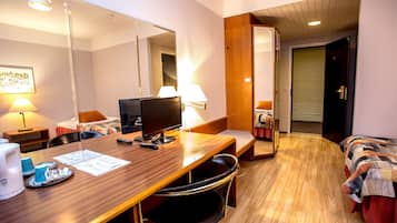 Desk, laptop workspace, bed sheets