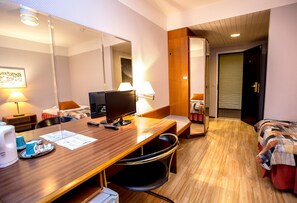 Desk, laptop workspace, bed sheets