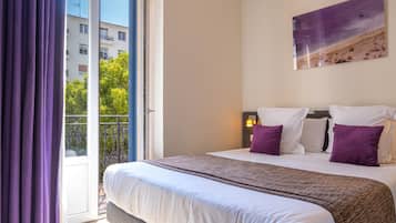 Premium bedding, memory foam beds, in-room safe, blackout drapes